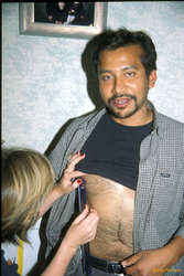 Shalabh getting his nipple measured by Jess