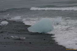 Chunks of ice getting washed back on shore at Jökulsárlón