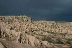Erosion landscape near Çavuşin in front of a threating storm