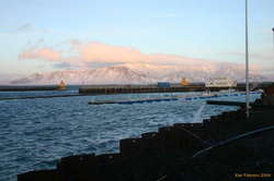 Snow, Esja, and a deserted harbour