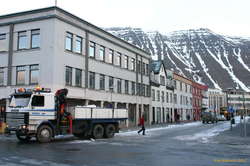 Snow trucking out of downtown Ísafjörður