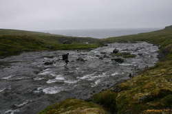 Crossing a stream above Hrollaugsvík