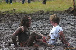 Boys playing in the mud
