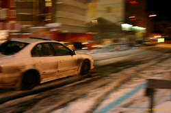 Speeding down a snowy street