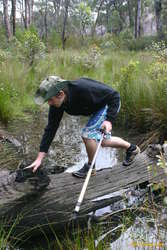 Matthew crossing a log