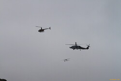 Out of frame, 2 more helicopters, bunch of drones