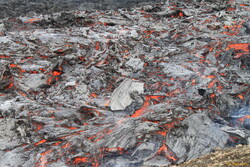 Freshly cooling lava getting pushed along