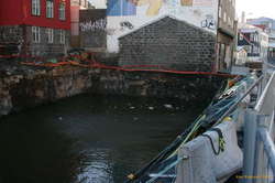 Basically a flooded hole full of rubbish