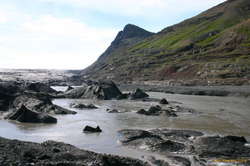 We need to cross this river.  We ended up having to go right up to the head of the river and climb up onto the hillside on the right
